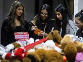 Volunteers from Seva Yeg assemble Valentine's Day care packages of teddy bears and chocolates at Nerval Corp, 1001 Buckingham Drive, in Sherwood Park on Wednesday, Feb. 13, 2019. The care packages, which included handmade cards from Calder Elementary School students, will be delivered to three women's shelters in Edmonton and Sherwood Park on Valentine's Day.