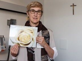 Deb Kirkpatrick, chaplain at the Misericordia Community Hospital, shows a sign that hospital staff use to denote a terminal patient's final part of life in one of five new compassion rooms on Thursday, Feb. 14, 2019.