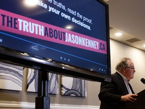 NDP government house leader Brian Mason unveils a website called thetruthaboutjasonkenney.ca during a news conference in Edmonton, on Thursday, Feb. 14, 2019.