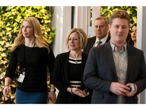 Premier Rachel Notley, centre, arrives to speak about the Alberta government's rail deal between Canadian Pacific Railway, Canadian National Railway and the Government of Alberta to move oil by rail during a news conference in Edmonton on Tuesday, Feb. 19, 2019.