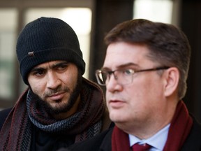 Omar Khadr speaks outside court in Edmonton on Thursday, Dec. 13, 2018. Khadr sought a Canadian passport to travel to Saudi Arabia and wants permission to speak to his sister but was denied.
