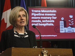 Alberta Premier Rachel Notley unveils an ad they will be running in B.C. about the pipeline expansion in Edmonton, Alta., on Thursday, May 10, 2018.