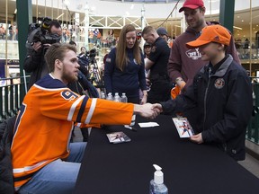 Edmonton Oilers captain Connor McDavid signs an autograph for Diezyl Hehr at West Edmonton Mall on Monday, Feb. 18, 2019.