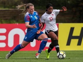Canadian midfielder Ashley Lawrence, right, is challenged by Iceland defender Ingibjorg Siguroarddottir at the Algarve Cup in Parchal, Portugal on Wednesday, Feb. 27, 2019. The game ended in a 0-0 tie.