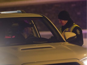 A police checkstop in Edmonton is seen on Dec. 6, 2018. Police dealt with less than 100 instances of cannabis-impaired driving in 2018, according to a recent report.