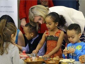 Alberta Premier Rachel Notley talks with Besma Behik (4-years-old) at the Intercultural Child and Family Centre, a daycare and out-of-school care centre in Edmonton, on Thursday April 6, 2017, where the Alberta government announced that 22 pilot Early Learning and Child Care Centre will receive funding to demonstrate the importance and viability of $25-a-day child care in Alberta.