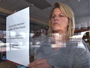 Posting a help save our business sign is Leanne Heidenreich, co-owner of Dorothy's Appliance, says shops along 95 Avenue may not survive the proposed prolonged LRT Valley Line construction closure of the avenue in Edmonton.