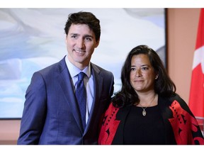 Prime Minister Justin Trudeau and Veterans Affairs Minister Jodie Wilson-Raybould attend a swearing in ceremony at Rideau Hall in Ottawa on Monday, Jan. 14, 2019. The Globe and Mail says former justice minister Jody Wilson-Raybould disappointed the Prime Minister's Office by refusing to help SNC-Lavalin avoid a criminal prosecution.