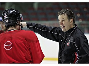 Team Canada head coach Marc Habscheid speaks to Sidney Crosby during practice at the IIHF World Hockey Championships Friday, May 19, 2006, in Riga, Latvia. Habscheid's Prince Albert Raiders are in the midst of a record-setting season, but the coach says the top squad in the Western Hockey League is still a long way from achieving their goals.