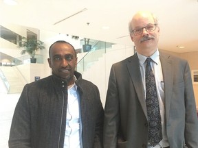 Nyala Lounge owner Mulugeta Tesfay, left, and his lawyer Tom Engel speak outside an city tribunal following a decision on Tuesday Feb. 19, 2019, that will allow the lounge to re-open for business.