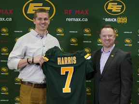 Edmonton Eskimos newly acquired quarterback Trevor Harris (left) receives an Eskimos jersey from general manager Brock Sunderland (right) in the team dressing room at Commonwealth Stadium on Thursday February 14, 2019.