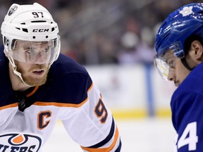 Edmonton Oilers centre Connor McDavid (97) takes a faceoff against Toronto Maple Leafs centre Auston Matthews (34) during first period NHL action in Toronto, Wednesday, Feb. 27, 2019.