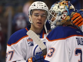 Edmonton Oilers center Connor McDavid, left, congratulates goalie Cam Talbot after the Oilers defeated the Colorado Avalanche in an NHL hockey game in Denver on Nov. 23, 2016.