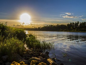 The sun sets over the Snye in Fort McMurray on July 27, 2016.