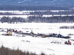 Excavators work at the site of a train derailment 10 kilometres south of St. Lazare, Man. on Saturday. A train carrying oil has derailed and is leaking in western Manitoba. Canadian National Railway says in a statement that 37 cars carrying crude left the tracks early Saturday morning near St. Lazare, just east of the Saskatchewan-Manitoba boundary.