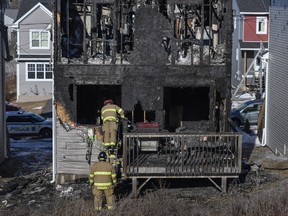 Firefighters investigate following a house fire in the Spryfield community in Halifax on Tuesday, February 19, 2019.