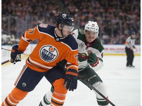 Oscar Klefbom of the Edmonton Oilers, is chased down by Joel Eriksson Ek of the Minnesota Wild at Rogers Place in Edmonton on Dec. 7, 2018.