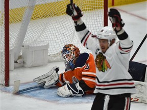 Edmonton Oilers’ goaltender Cam Talbot (33) looks on as the Chicago Blackhawks celebrate a goal during NHL action at Rogers Place in Edmonton, February 5, 2019.
