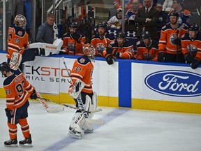 After another goal Edmonton Oilers goalie Cam Talbot (33) gets pulled from the game as goalie Mikko Koskinen (19) stretches getting ready to go in against the Chicago Blackhawks during NHL action at Rogers Place in Edmonton, February 5, 2019. Ed Kaiser/Postmedia