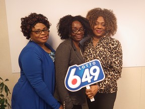 Evelyn Osamudiamen,  Edna Iwemjiwe and Funmi Owota split a $1-million Lotto 6/49 prize.