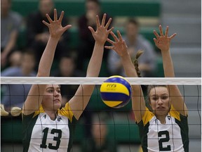 University of Alberta Pandas Myja Wildenhoff and Lauryn Tremblay block the ball during play against the Thomson Rivers Wolfpack on Friday, Feb. 22, 2019, in Edmonton.