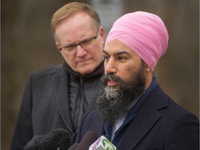 NDP Leader Jagmeet Singh stands with New Westminster-Burnaby MP Peter Julian outside Bill Copeland Community Centre in Burnaby.