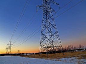 Dawn breaks over transmission lines in Edmonton.