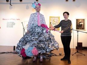 David Cameron, left, and Kate Beneteau take part in the cutting of the skirt during the SkirtsAFire Festival opening ceremonies.