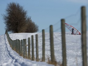 A windsurfer prepares to launch at the University of Alberta Farm, near 62 Avenue and 128 Street, in Edmonton Wednesday March 6, 2019.