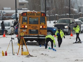 Edmonton Police Service officers investigate after two teenage girls from Bessie Nichols School were sent to hospital after being struck by a school bus on Hemingway Road and 205 Street in Edmonton, on Friday, March 8, 2019.