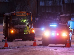 Edmonton Police Service officers investigate after two teenage girls from Bessie Nichols school were sent to hospital after being struck by a school bus on Hemingway Road and 206 Street in Edmonton on Friday, March 8, 2019.