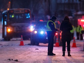 Edmonton Police Service officers investigate after two teenage girls from Bessie Nichols School were sent to hospital after being struck by a school bus on Hemingway Road and 205 Street in Edmonton, on Friday, March 8, 2019.