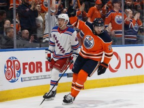 Edmonton Oilers' Leon Draisaitl (29) celebrates Connor McDavid's (97) goal on the New York Rangers during the first period of a NHL game at Rogers Place in Edmonton, on Monday, March 11, 2019.