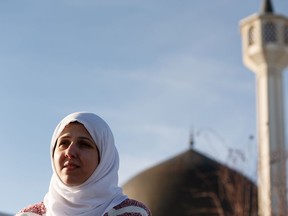 Noor Al-Henedy with Al Rashid Mosque speaks about the impact of terrorist attacks on praying Muslims in New Zealand on the community of Edmonton Muslims outside the mosque in Edmonton, on Friday, March 15, 2019 .