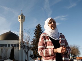 Noor Al-Henedy with Al Rashid Mosque speaks about the impact of terrorist attacks on praying Muslims in New Zealand on the community of Edmonton Muslims outside the mosque in Edmonton, on Friday, March 15, 2019 .