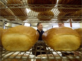 United Conservative Party leader Jason Kenney chats with Vienna Bakery owner Brian Jaeger, following a press conference at the bakery, in Edmonton Friday March 15, 2019. Photo by David Bloom