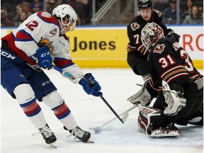 Edmonton Oil Kings' Liam Keeler (12) breaks his stick on a shot on Calgary Hitmen's goaltender Jack McNaughton (31) during the third period of a WHL hockey game at Rogers Place in Edmonton, on Saturday, March 16, 2019.