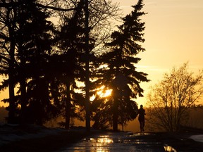 A jogger makes their way along Victoria Park Road near 116 Street, in Edmonton Tuesday March 19, 2019.