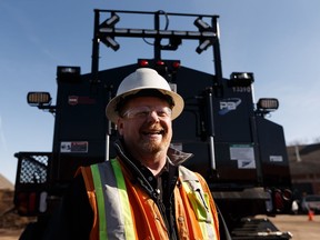 Scott VanDusen, Roadway Maintenance Supervisor, grins while explaining the updated features of the city's newest asphalt combination unit in the city's Central Yard in Edmonton, on Thursday, March 28, 2019. With the coming of spring, potholes have sprung up around the city, giving crews plenty of potholes to fill.