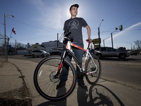 Shayne Stonehocker with his bicycle near 111 Avenue and 97 Street in Edmonton on March 30, 2019. Stonehocker is a regular volunteer with the Edmonton Bicycle Commuters Society at Bikeworks North. In the past, Stonehocker says he has received tickets for riding his bicycle on sidewalks in areas of the city that lack bike infrastructure.