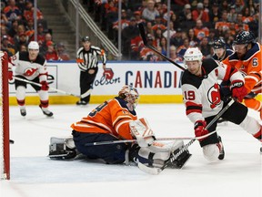 Edmonton Oilers' goaltender Mikko Koskinen (19) is scored on by New Jersey Devils' Travis Zajac (19) during the first period of a NHL game at Rogers Place in Edmonton, on Wednesday, March 13, 2019. Photo by Ian Kucerak/Postmedia