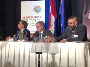 Cabinet ministers Oneil Carlier, minister of agriculture and forestry, David Eggen, minister of education, and Shaye Anderson, minister of municipal affairs, speak to rural school board trustees and leaders from across the province at the Alberta Rural Education Symposium in Edmonton on Sunday, March 3, 2019.