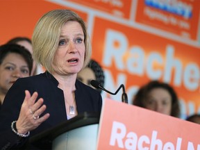 Surrounded by campaign signs, Alberta Premier Rachel Notley speaks at an NDP rally in Calgary on Thursday, March 7, 2019.