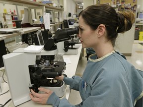 A medical laboratory technologist at work in the DynaLIFE central lab facility in Edmonton. File photo.