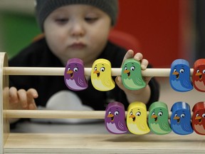 Alberta Premier Rachel Notley talks with Besma Behik (4-years-old) at the Intercultural Child and Family Centre, a daycare and out-of-school care centre in Edmonton, on Thursday April 6, 2017, where the Alberta government announced that 22 pilot Early Learning and Child Care Centre will receive funding.