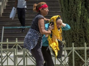 Family members of the victims involved in a plane crash react at Addis Ababa international airport Sunday, March 10, 2019.