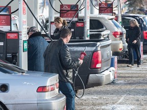 Edmontonians lined up at the pumps on Dec. 31, 2016, to save 4.5 cents a litre before Alberta's carbon tax kicked in on Jan. 1, 2017.