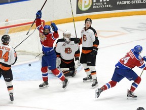 Edmonton Oil Kings Quinn Benjafield (14) and Dylan Guenther celebrate after scoring a goal on Medicine Hat Tigers goaltender Mads Søgaard during Game 4 of the Western Hockey League's Eastern Conference quarter-final on Wednesday, March, 27, 2019 at the Canalta Centre.