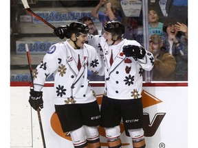 Calgary Hitmen's Carson Focht scores on Kootenay Ice goalie Jesse Makaj in third period action at the Scotiabank Saddledome as the WHL Hitmen Suited up with Don Cherry to Promote Organ Donation on Sunday March 3, 2019. Darren Makowichuk/Postmedia