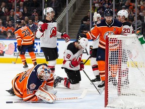 Edmonton Oilers' Adam Larsson (6) and goaltender Mikko Koskinen (19) react as New Jersey Devils' Travis Zajac (19) celebrates his goal during first period NHL action at Rogers Place in Edmonton, Alta., on Wednesday, March 13, 2019.